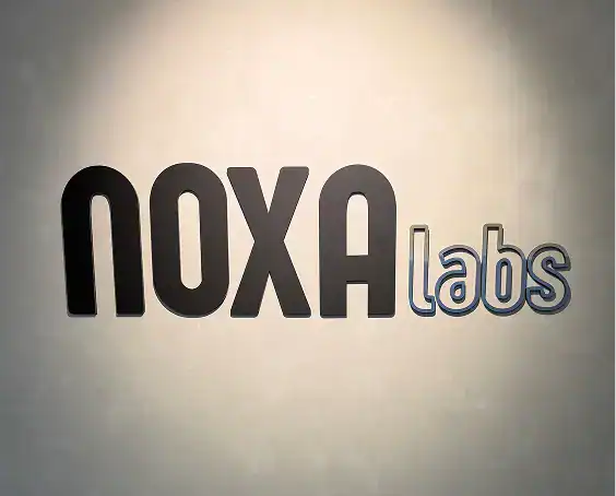 Noxa Labs logo on wall, modern branding for fitness and health innovation.
